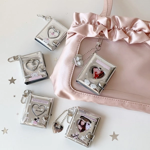 Mini silver photo card holder keychain featuring a heart cutout and cute puppy design