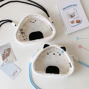 Detail of plush rice ball bag featuring clear window and cute cat ear design accents