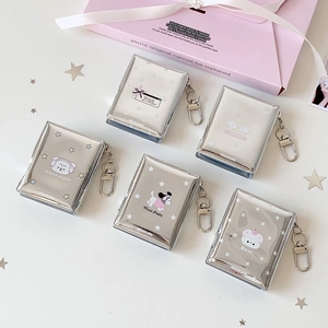 Detail view of five silver glitter 2-inch heart hollow photocard albums with D-ring hooks