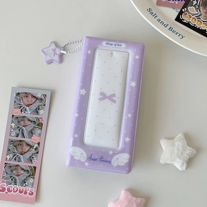 Detail view of purple Angel Fantasy photocard binder with transparent window and star charm