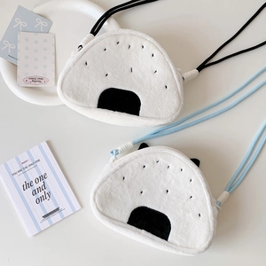 Detail of plush Onigiri bags with faux rabbit fur texture and sea weed design