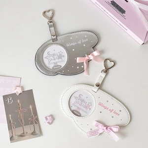 Close-up of cloud-shaped PU leather photocard holders with pink bows and heart hooks