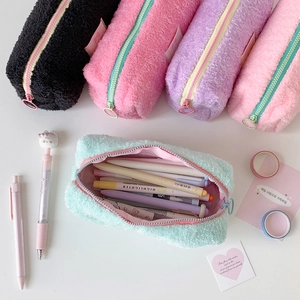 Detailed close-up of fluffy plush pencil cases in five colors with large capacity