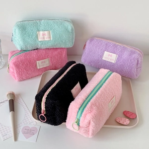 Cute fuzzy plush pencil cases in pastel colors with lucky gate embroidery for students