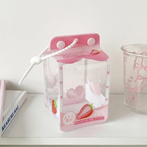 Detailed shot of strawberry milk carton doll bag with clear PVC and beaded handle