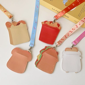 Dettaglio di sei porta tessere in pelle PU a forma di cibo cartoon con cordini colorati