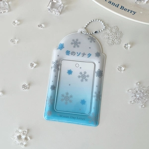 Detailed view of blue gradient PVC card holder with snowflake patterns and bead chain