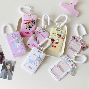 Detailed view of colorful cartoon card holders with spring lanyards and acrylic charms