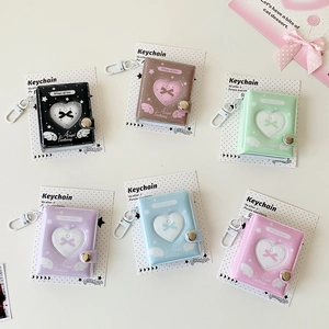 Portachiavi mini album fotografico con finestra a cuore in sei colori pastello e ali