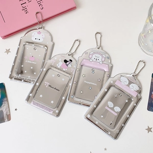 Detail of four transparent acrylic 3-inch photo card holders with cute cartoon dog designs