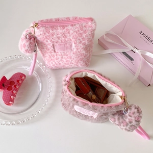 Winter plush leopard print cosmetic bag with heart keychain and secure zipper closure