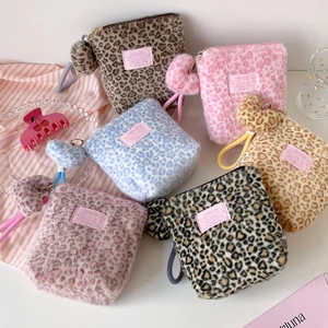 Cute plush leopard print cosmetic bags in multiple colors with heart charms and wrist straps