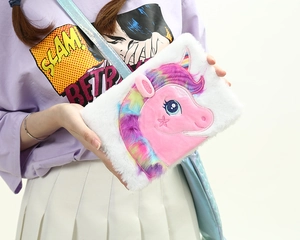 White plush unicorn notebook with rainbow fur and a laser strap worn as a crossbody bag