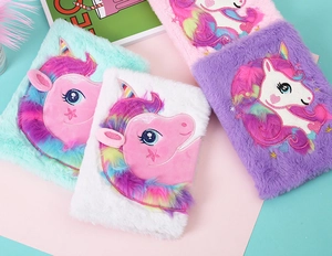 Detail showing plush unicorn notebook covers in mint green, white, purple, and pink colors
