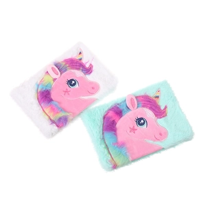 Close-up of fluffy unicorn plush notebook covers with rainbow hair and embroidery