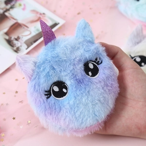 Close-up of cute plush unicorn coin purse with purple horn and gradient blue fur