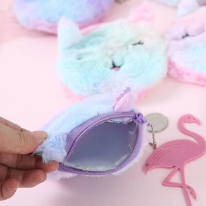 Detail of plush gradient cat coin purse with soft fur, metal chain, and blue inner lining