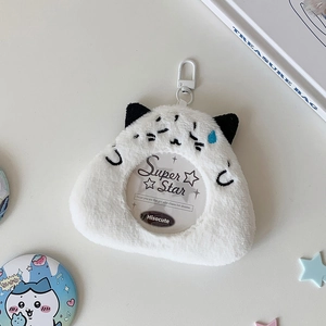 Macro shot of white plush cat charm badge holder with clear window and plastic clip