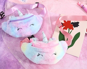 Close-up of plush unicorn waist bags with soft faux fur and adjustable colorful straps