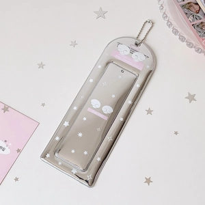 Macro detail of silver star card holder with angel wings design and metal chain