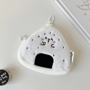 Macro detail of plush rice ball coin purse featuring a star-shaped zipper and plastic hook