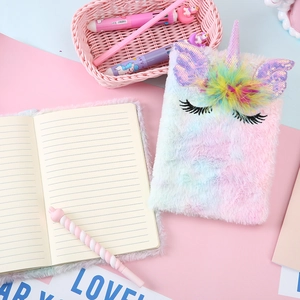 Cute plush unicorn notebook with pink and blue gradient fur and glitter ears