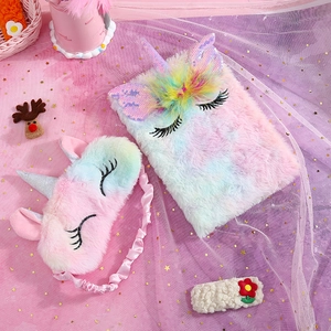Unicorn plush notebook set with sleep mask and hair clip on dreamy pink star background