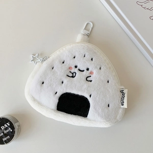 Detail of plush rice ball wallet with star zipper, embroidery, and soft furry texture