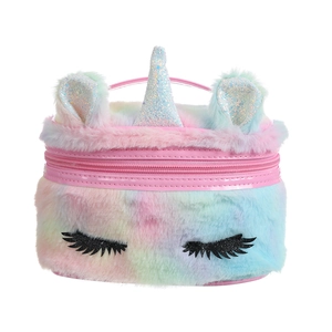 Detailed view of plush unicorn makeup bag with rainbow fur and sequin eyelash embroidery