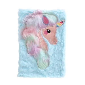 Close-up of fluffy blue unicorn notebook featuring rainbow horn and sequin embroidery details