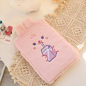 Detail of pink plush tablet sleeve featuring cute bunny embroidery and soft 3D ears