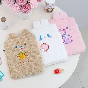 Detailed view of plush tablet sleeves featuring cute bear and rabbit embroidery patterns