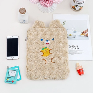 Detailed close-up of a plush 11-inch iPad sleeve with cute bear and rabbit embroidery