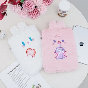 Detail of plush 11-inch iPad sleeves with 3D bunny ears and cute cartoon embroidery