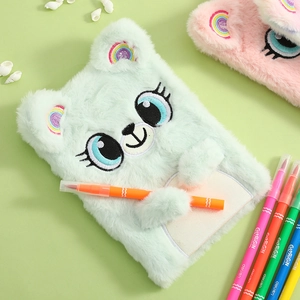 Detail of plush bear notebook with 3D ears, soft faux fur texture, and pen holder clip
