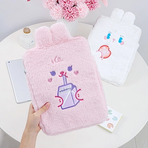 Detail of plush 11 inch iPad cases with cute rabbit ears and fruit embroidery in pink and white