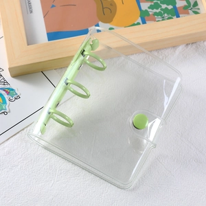 Mini 3-ring binder made of clear PVC with pastel green metal rings for photo cards