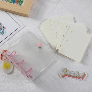 Mini 3-hole clear PVC binder notebook with pink rings and a smiley face pendant