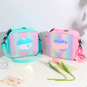Detail of glitter rainbow lunch bags in mint and pink with laser heart-shaped patches