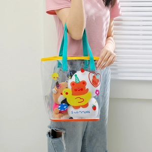 Transparent PVC swimming bag with cartoon bear print and blue handles for beach use
