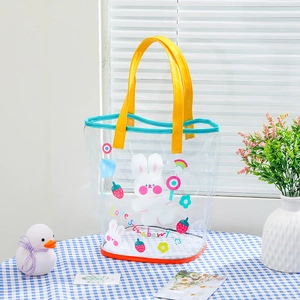 Detail of transparent PVC tote bag with cartoon rabbit and yellow glossy handles