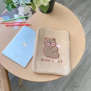 Detail of embroidered teddy bear and Bear Love text on khaki plush tablet sleeve