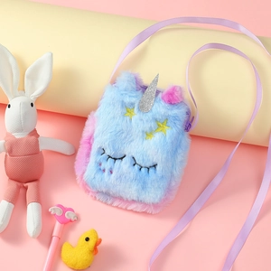 Close-up of unicorn plush crossbody bag with sequined horn and embroidered details