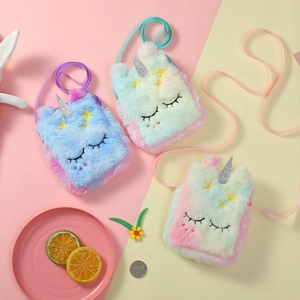 Detailed view of colorful plush unicorn bags with embroidery and sequin horns