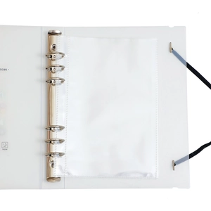 Detail view of A5 6-ring binder notebook with silver metal rings and black elastic strap
