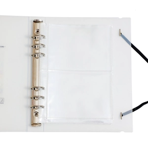 Close-up of translucent A5 photo album with 6-ring metal binder and elastic strap