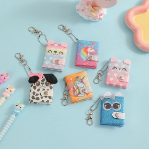 Detail of mini glitter sequin notebooks with cute animal patterns and metal lobster clasps