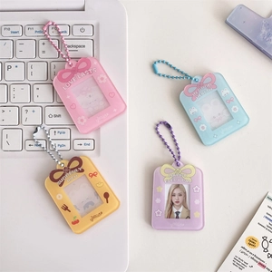 Detail of acrylic photocard holders in four pastel colors with matching bead chains