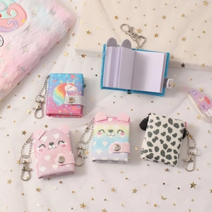 Set of five mini cartoon unicorn and bear notebooks with metal keychain hooks