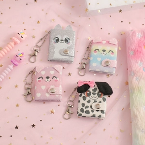 Detail of glitter sequins and plush mini animal coin purses with metal keychains